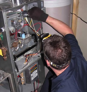 Performing  furnace Repairs on a Carrier furnace in Fort Saskatchewan